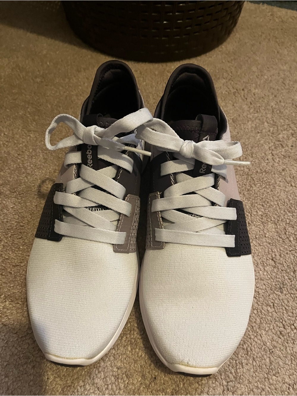 Reebok White, Black, and Lavender running shoes.